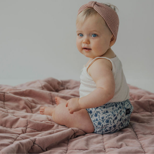baby girl in a cloth nappy