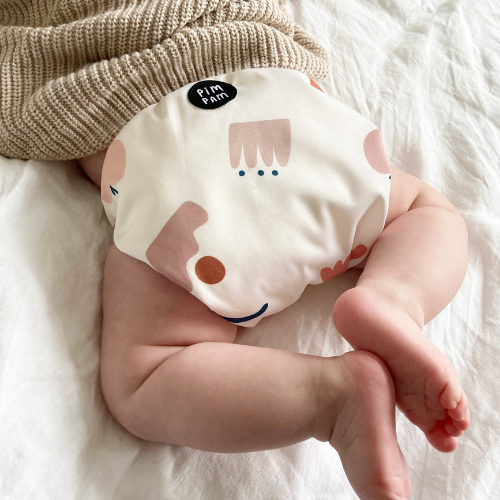 Baby cloth nappy with a newborn cardigan