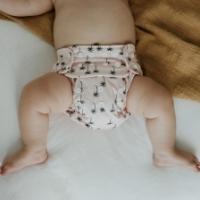 One size nappy on baby