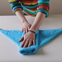 Folding a terry nappy square